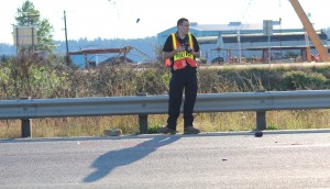 An investigator takes pictures at the scene