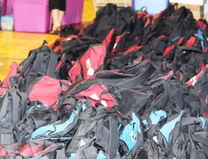 Hundreds of free backpacks were being filled with needed items.
